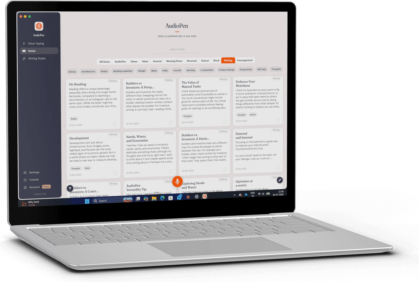 The AudioPen desktop app on a laptop, showing a library of notes organized by tags, with the orange record button.